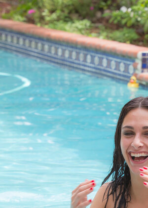 Beautiful doll in white yoga pants shows her perfect naked body by the pool