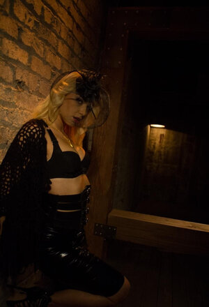 Ravishing vampire sneaks in darkened cellar to show oozy jugs near wall