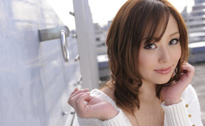 Entrancing Japanese performer comes to the roof where flashes bra buddies and pussy