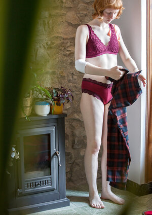 Pale redhead broad covers natural boobs with burgundy underwear on the spy camera