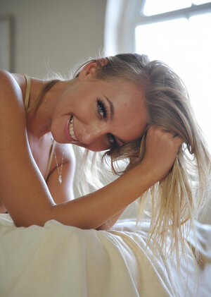 Profligate gal with nice perky tits slowly removes clothes to pose undressed