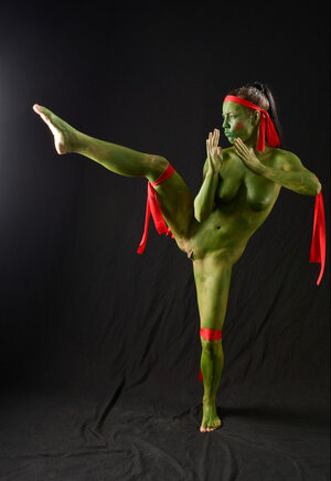 Kitten is going to be a Ninja Turtle so she practices some moves in the undressed