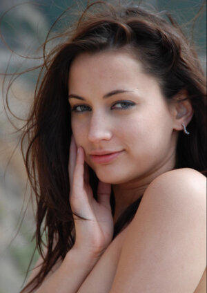 Floozy with makeup on removes yellow bikini & shows off tiny boobs on the beach