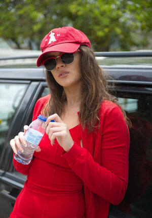 Kinky brunette doll flashes round bum before showing off perky tits