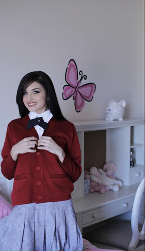 Offensive floozy with long black hair flashes her undersized tits without stripping