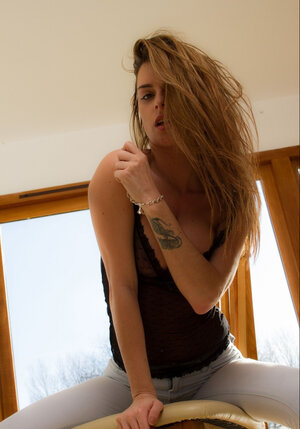 Lovely brunette legal teen slowly gets naked to demonstrate her huge perky tits and moreover tush