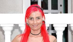 Kinky red-haired nympho doffs clothes and moreover spreads legs to display cunny