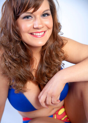 Breasty seductress Hannah Sharp tries on sexy outfits in front of the camera