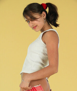 18-19 year old strips down leaving only striped high socks on her sexy skinny legs