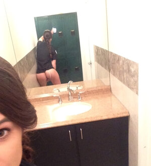Aroused young policewoman poses nude by the mirror before fucking in the toilet