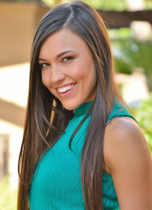 Gorgeous brunette sits outdoors on stairs and massages clit with vibrator