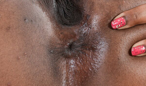 Cheerful broad Charlie Rae with black skin flaunt her private body parts